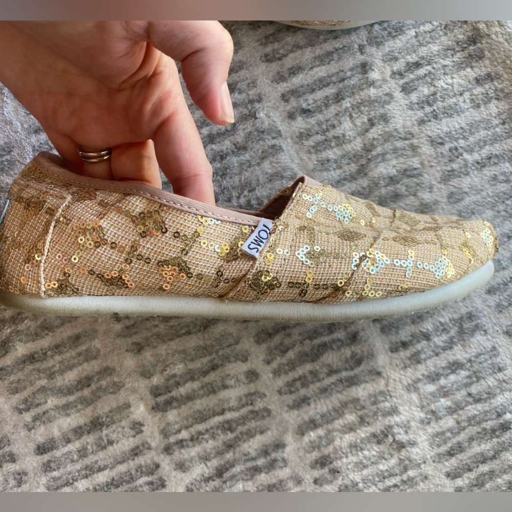 Tom’s neutral Alpargatas with gold bling